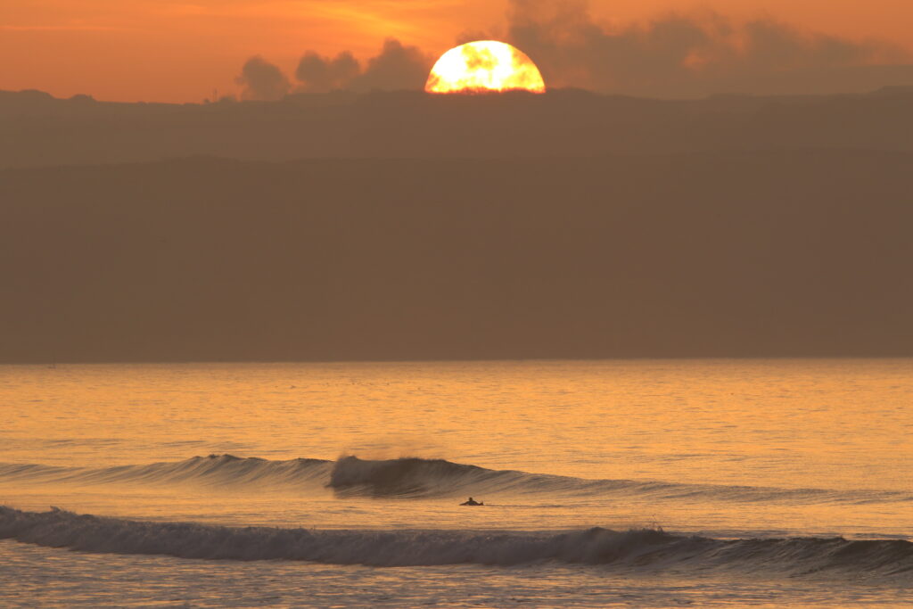 Gwithian sunset Cornwall surfer