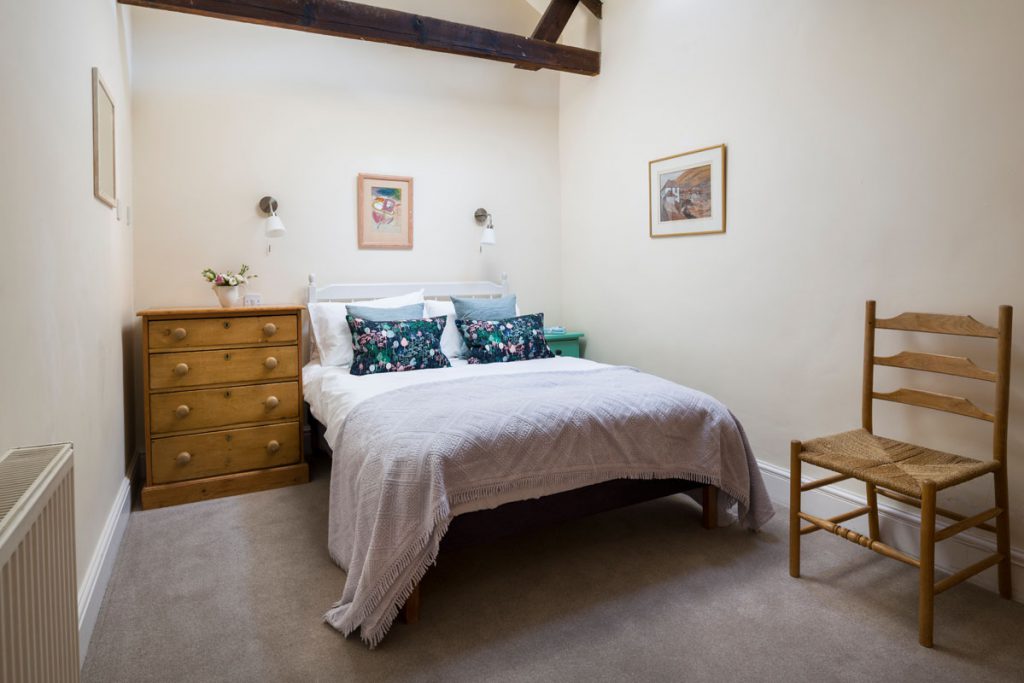 Bedroom at cottage with sea view at Port Gaverne - Rashleigh Cottage by Forever Cornwall